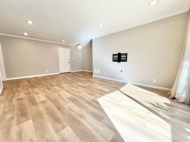 Photo - Contemporary 2 Bed Condo with 2 Garage Parking Spaces, Community Pool, and 3 Private Balconies