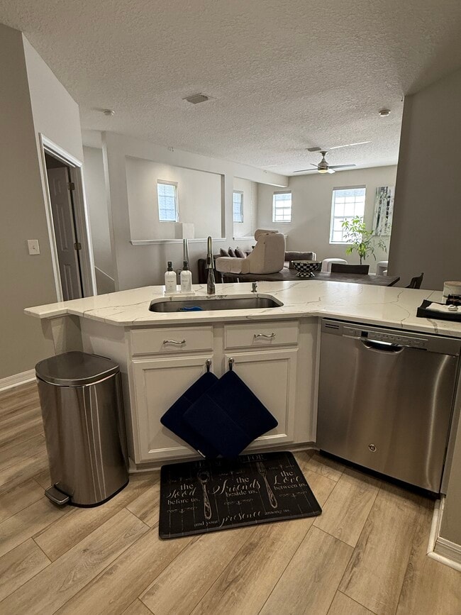 Kitchen overlooking entrance, living and dining area - 9410 Georgian Park Ln Unit 110