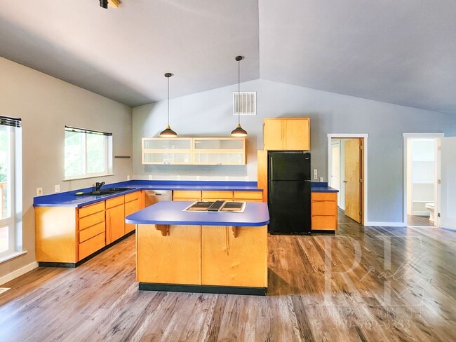 Photo - Vaulted Ceilings, Unique Designer Kitchen & Expansive Half-Acre Setting with Flexible Living Spaces