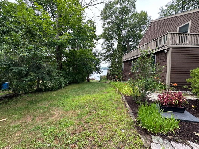Photo - Peaceful Waterfront Living: 2-Story Home on River Road with Ample Outdoor Storage & Water Extras!