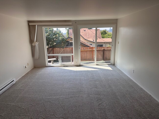 Living Room with access to Patio - 6223 3rd Ave NW Apartments Unit 2