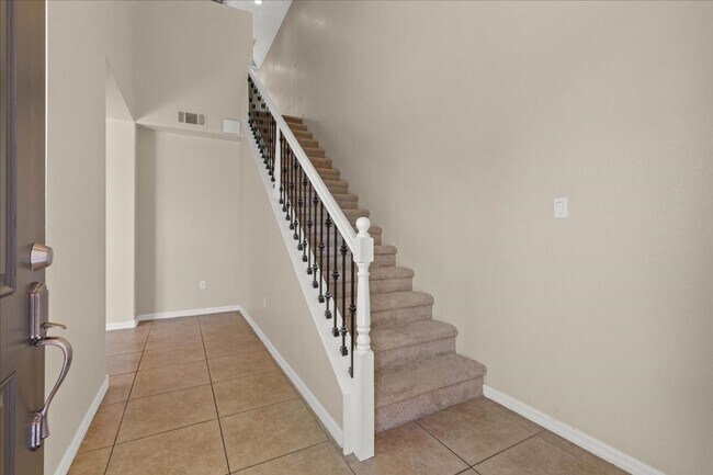 Photo - Spacious, Stylish & Partially Furnished 3-Bedroom Home with Attached Garage