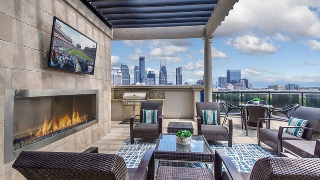 Rooftop lounge with outdoor fireplace, grill and amazing views of downtown
