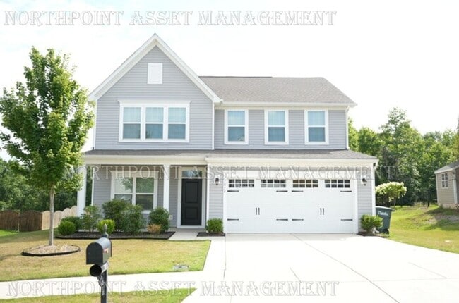 Building Photo - This wonderful home has a covered rocking ...