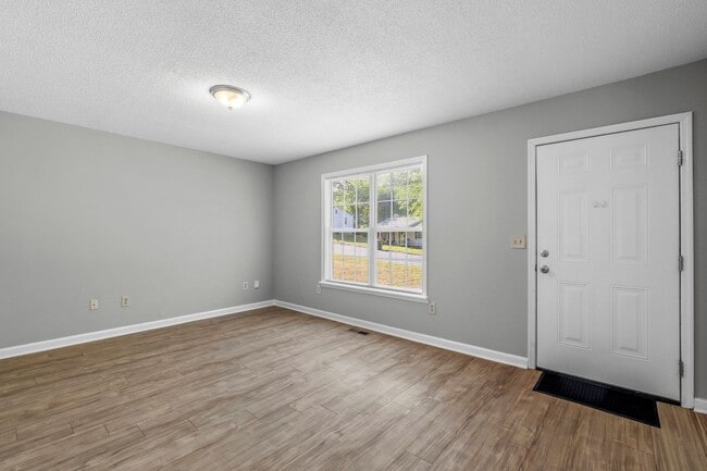 Photo - NW Home - Updated Kitchen and Bathrooms, Wood Laminate Flooring, Deck, Must See!