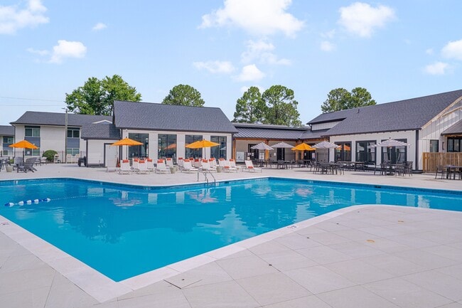 Relax in style at Crossings @ 501 Apartments, where a stunning pool and inviting lounge area await you. Soak up the sun on our spacious deck or gather with friends for a fun day by the water. Make it yours today!