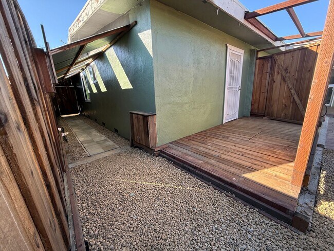 Photo - Hard floors, extra closets, patios & fence...