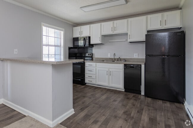 Gold One Bedroom with Black Appliances