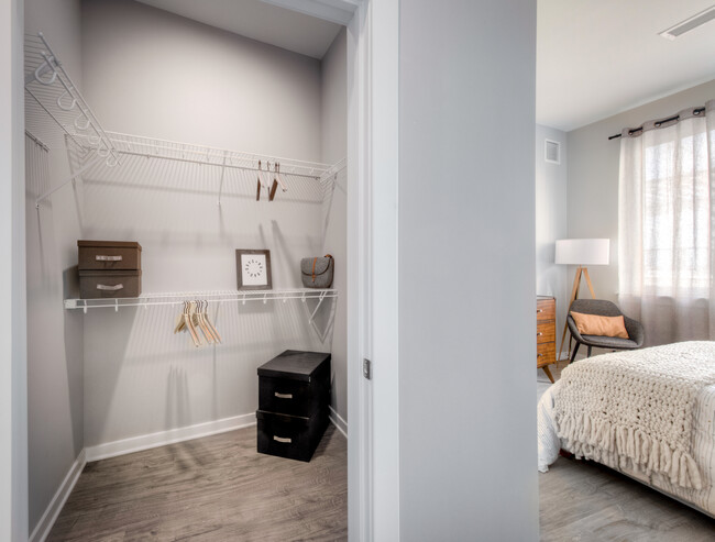 Walk-in closet with linen racks and storage space - Avalon Towson Apartments