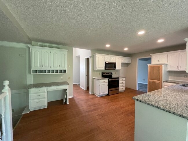 Photo - Welcome to this stunning 4-bedroom, 2.5-bathroom home located in the desirable Overland Park.