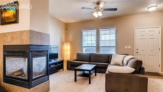 gas fireplace in living room with new LVP flooring