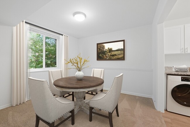 Elevate your living experience at Fairway Apartments with this inviting dining area, perfect for gatherings. Natural light and modern decor create a warm atmosphere. Ready to make this space your own? Schedule a tour today!