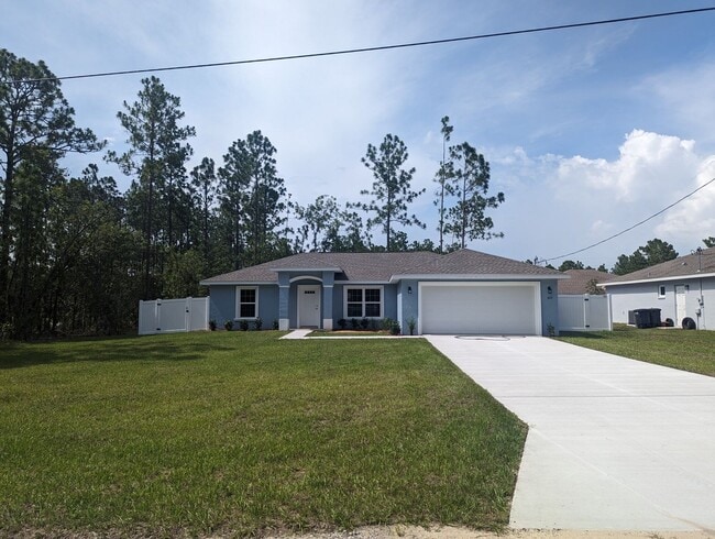 Building Photo - New 3/2/2 fenced home with Many Upgrades i...
