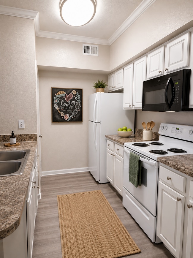 Photo - Spacious 2x2 vinyl plank flooring throughout, balcony & updated appliances