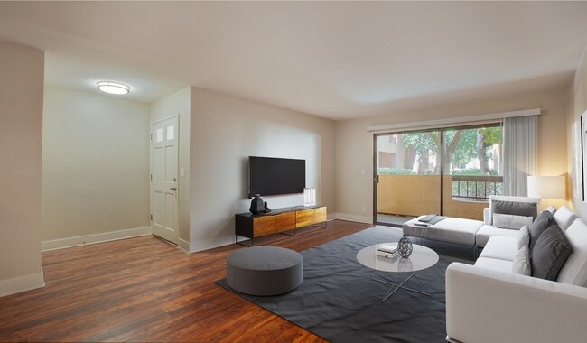 Spacious living room with wood flooring throughout