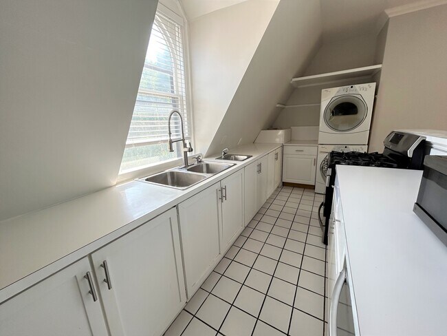 Kitchen w/ washer and dryer