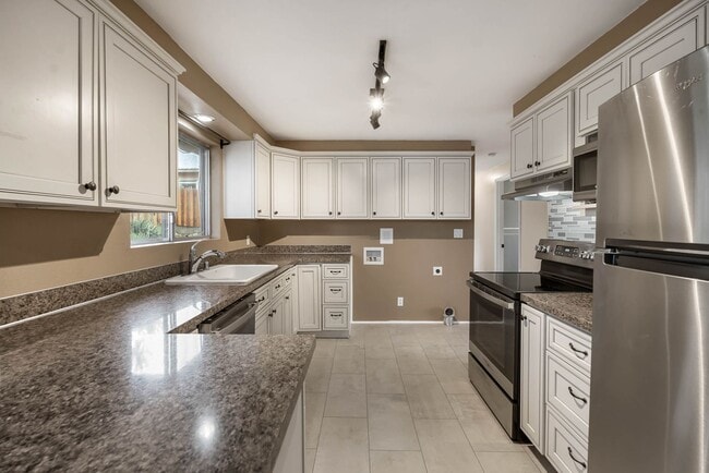 Photo - 4 Bedroom Home with Covered Parking & Fenced Backyard