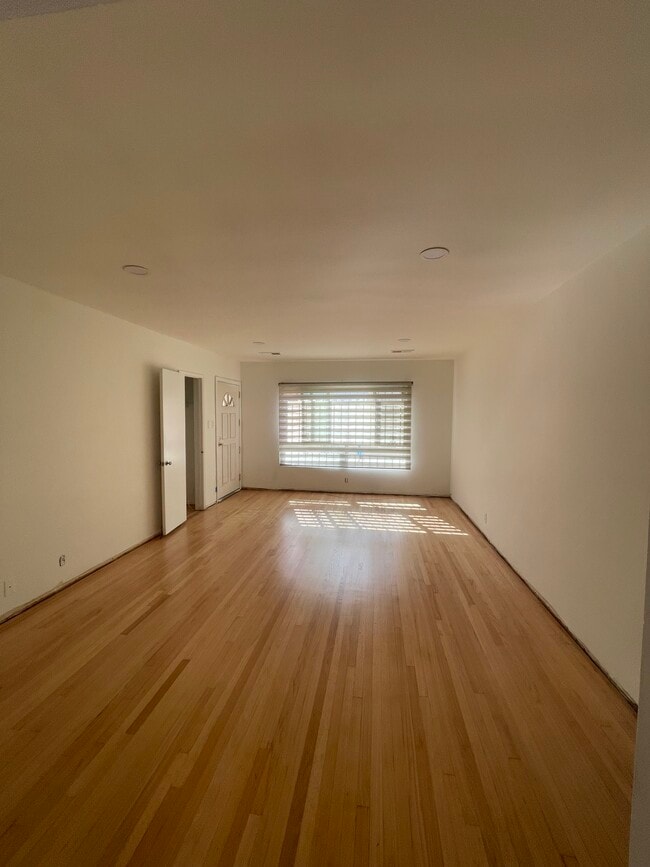 Large living room with solid oak hardwood and recess lighting - 10513 Crenshaw Blvd Unit 10513 Crenshaw Blvd #2