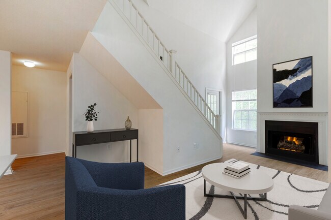 Renovated Package I living room with hard surface flooring. Lofts in select homes.