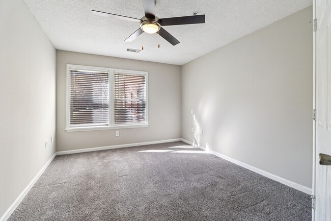 Cozy rooms feature plush carpeting and ceiling fans for year-round comfort, professionally operated by Highlands Vista Group.