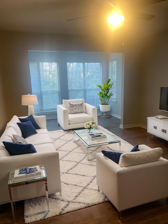 Introducing a serene living space at Riverwood Park Apartments, featuring elegant furnishings and abundant natural light. This inviting lounge is perfect for relaxation or entertaining. Don’t miss out—schedule a tour today!