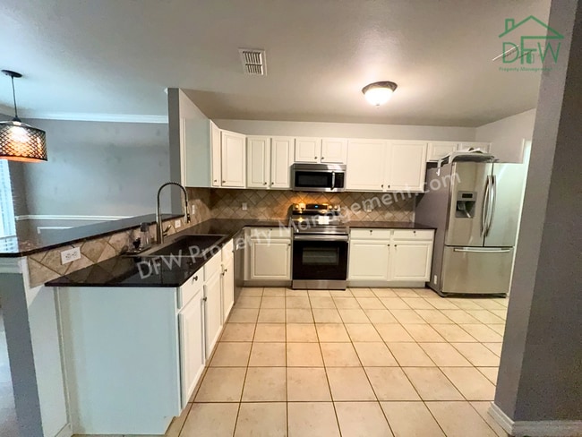 Photo - Charming 3BR/2.5BA Corner Home in Euless – Pool, Fireplace & Garage!