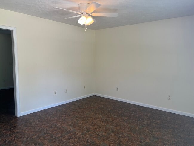 Living room with ceiling fan - 15 Cottage Ln