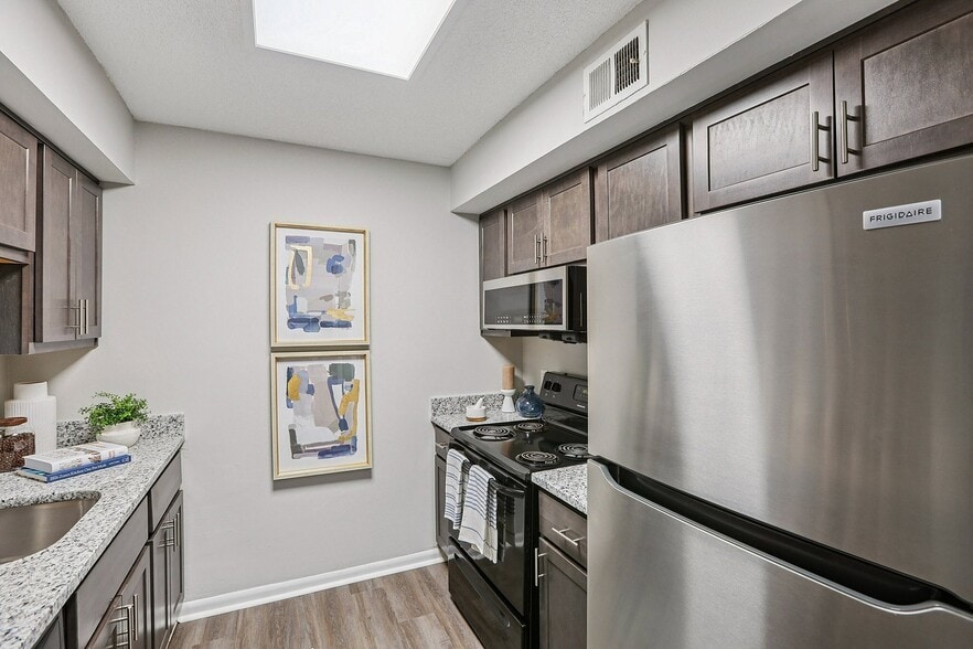 Kitchen with granite counters and modern cabinetry