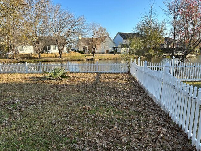 Photo - 3 x 2 with garage and pond view