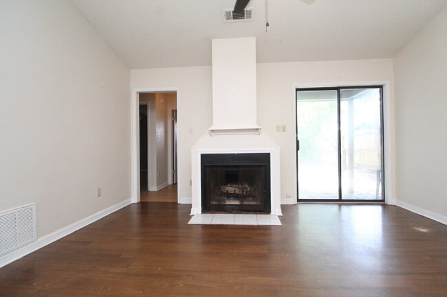 Photo - 2BR Home with Wood-Look Flooring, Fenced Backyard & Private Patio Unit D