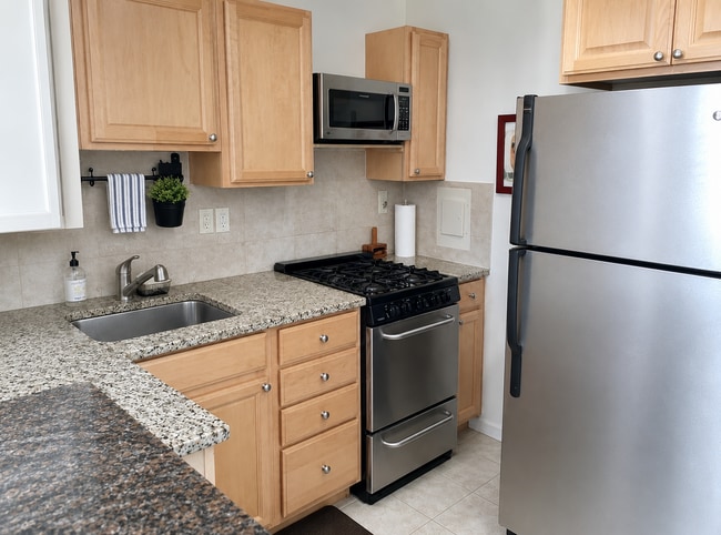 Kitchen with granite counter tops - 2939 Van Ness St NW Unit 1229