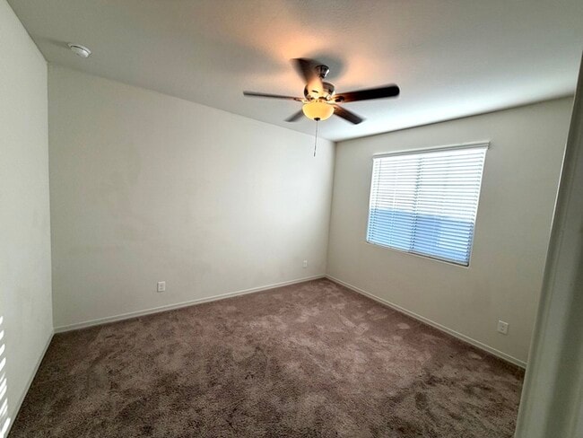 Beautiful 4BR/3BA single-story home in Harvest Queen Creek! Built in 2021 with 2,306 SF, den, che...