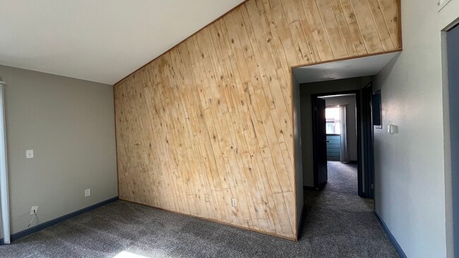 Freshly sanded natural wood wall. - 12063 E Harvard Ave Unit Harvard #203