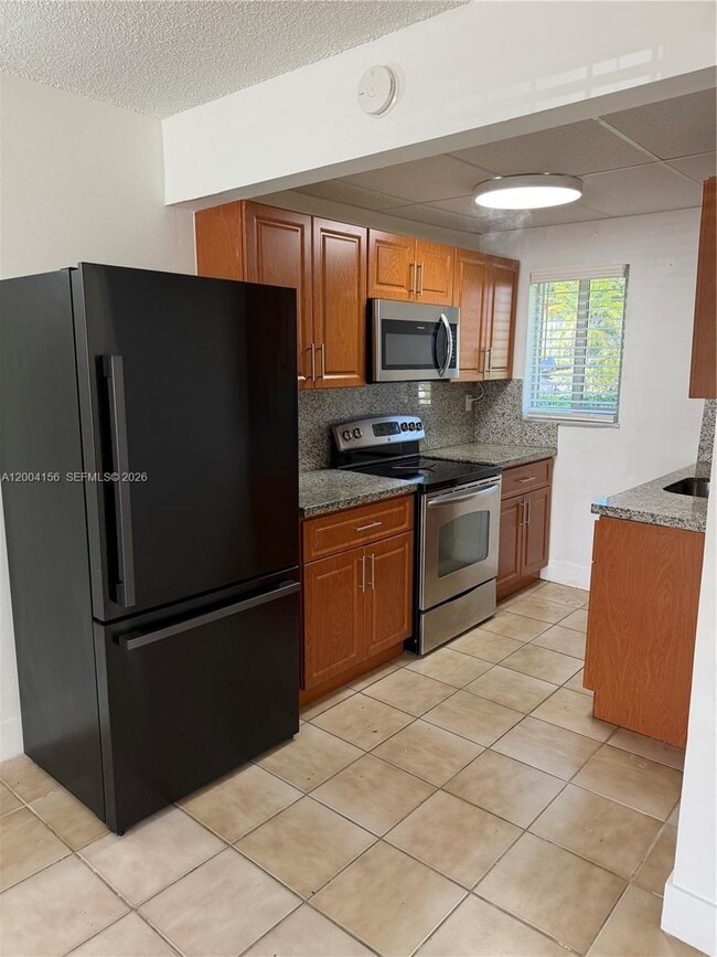 Building Photo - 4050 NW 135th St Unit 5-10