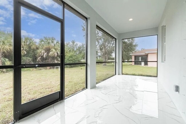Photo - Stunning 3BR/2BA Home with 2-Car Garage & Screened Lanai in Lehigh Acres