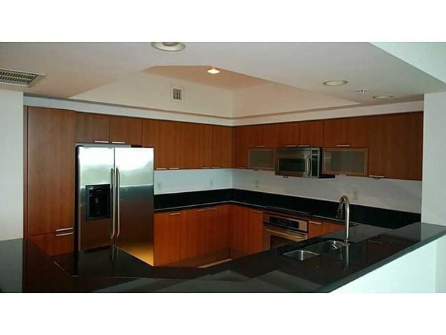 Building Photo - 14951 Royal Oaks Ln Unit 1608