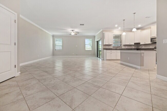 Photo - "Spacious 4-Bed Oasis with Granite Charm in Lutz!"In a gated community with 2 Cars garage