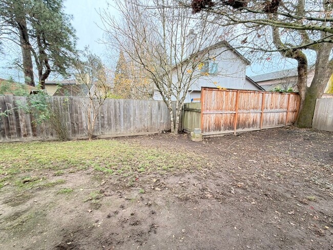 Photo - Comfortable Beaverton Home with AC, Fireplace, Large Fenced Yard, Spacious Garage and W/D!