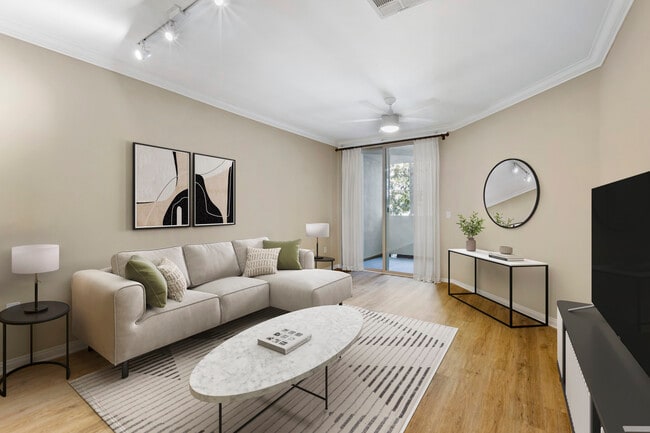 Renovated Package I living room with hard surface flooring