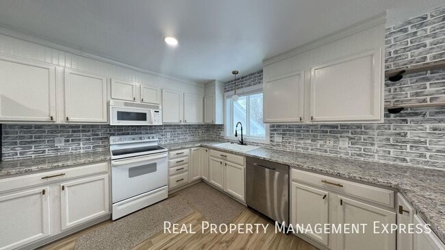 Photo - Spacious 4BR, 2BA Gem with Fireplace and Open Basement