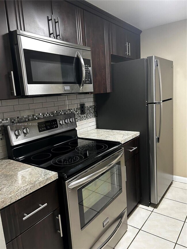 Building Photo - 7035 NW 186th St Unit D107 Rental