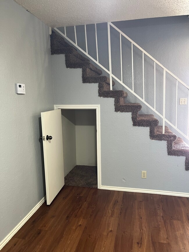 Storage under stairs and living room - 926 Chisholm Cv Unit 926 Chisholm Cv