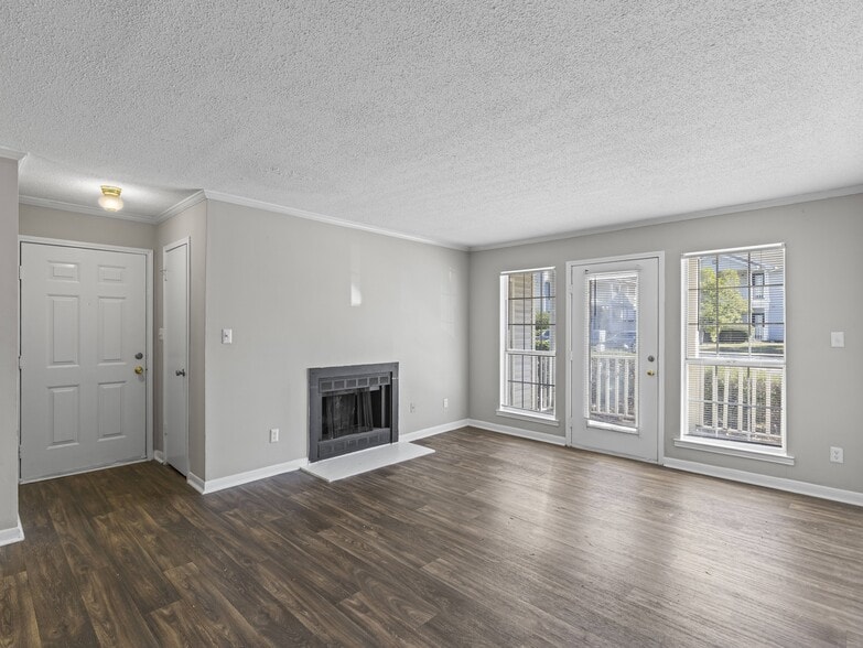 Enjoy indoor-outdoor living with cozy fireplace and sliding glass doors to your patio, professionally operated by Highlands Vista Group.