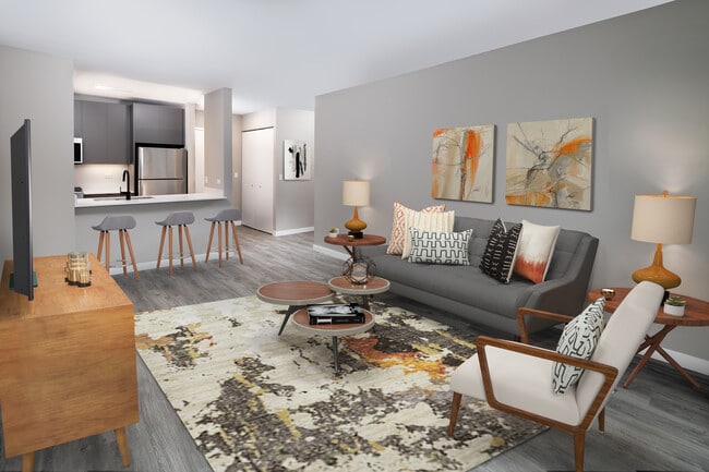 Renovated Package II living, dining, and kitchen areas with hard surface plank flooring