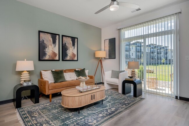 1BR, 1BA - 741SF - Living and Patio - The Flats of River Ridge