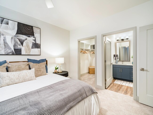 A comfortable primary bedroom with a connected primary bath and a spacious closet, offering a thoughtful layout for daily routines and unwinding.