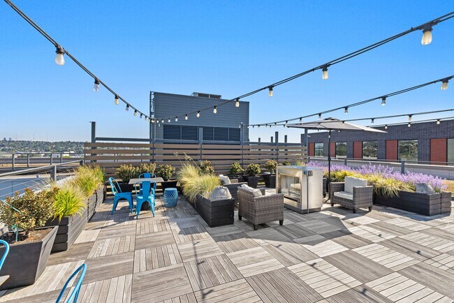 Fire up the grill and dine under string lights with sweeping rooftop views - Windsor Ballard
