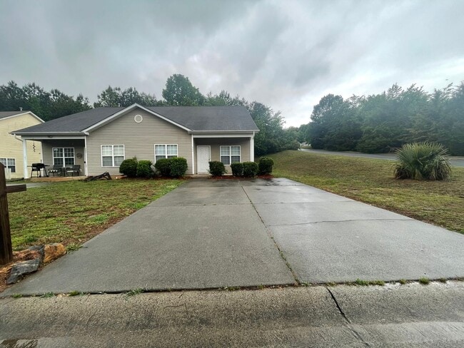 Building Photo - This two-story, 4-bedroom, 2-bath duplex in Fort Mill, SC sits on a corner lot