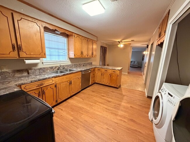 Photo - Welcome to this charming 3-bedroom, 2-bathroom home located in the heart of Russellville