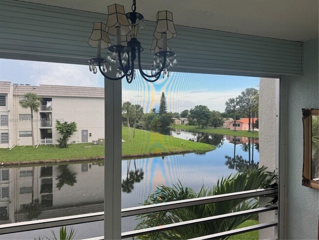 Building Photo - 8595 Sunrise Lakes Blvd Unit 206